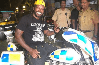 Chris Gayle enjoys his time in police officers in Mumbai