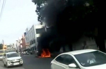 Chennai: Car charred in middle of road near Guindy.