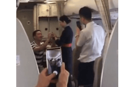 Air hostess accepts marriage proposal mid-air, loses job Air hostess accepts marriage proposal mid-air, loses job