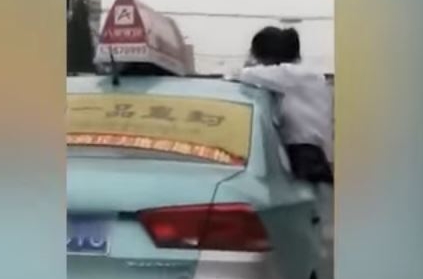 Girl does homework on top of car, video goes viral